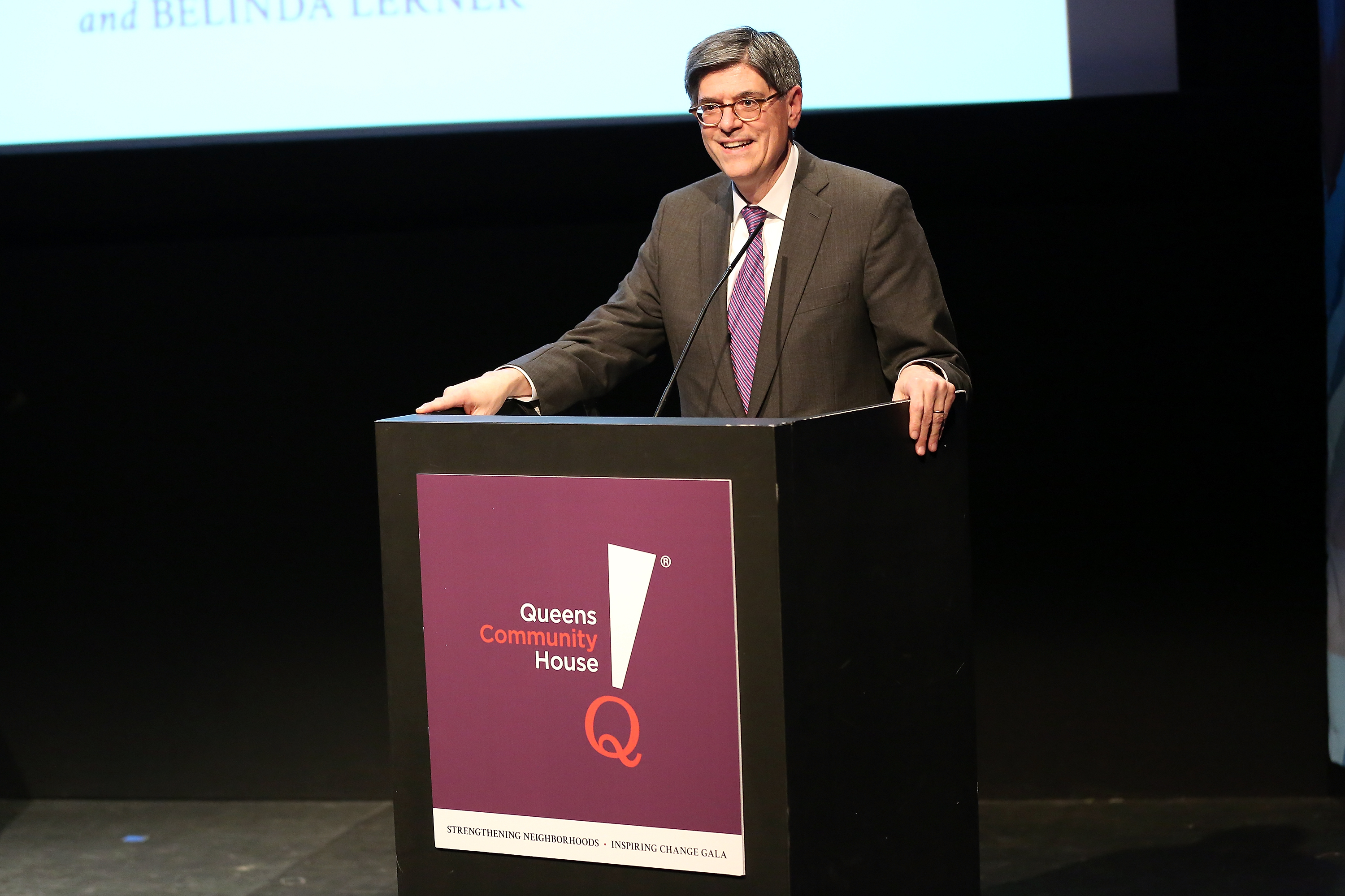 Man presenting at a podium